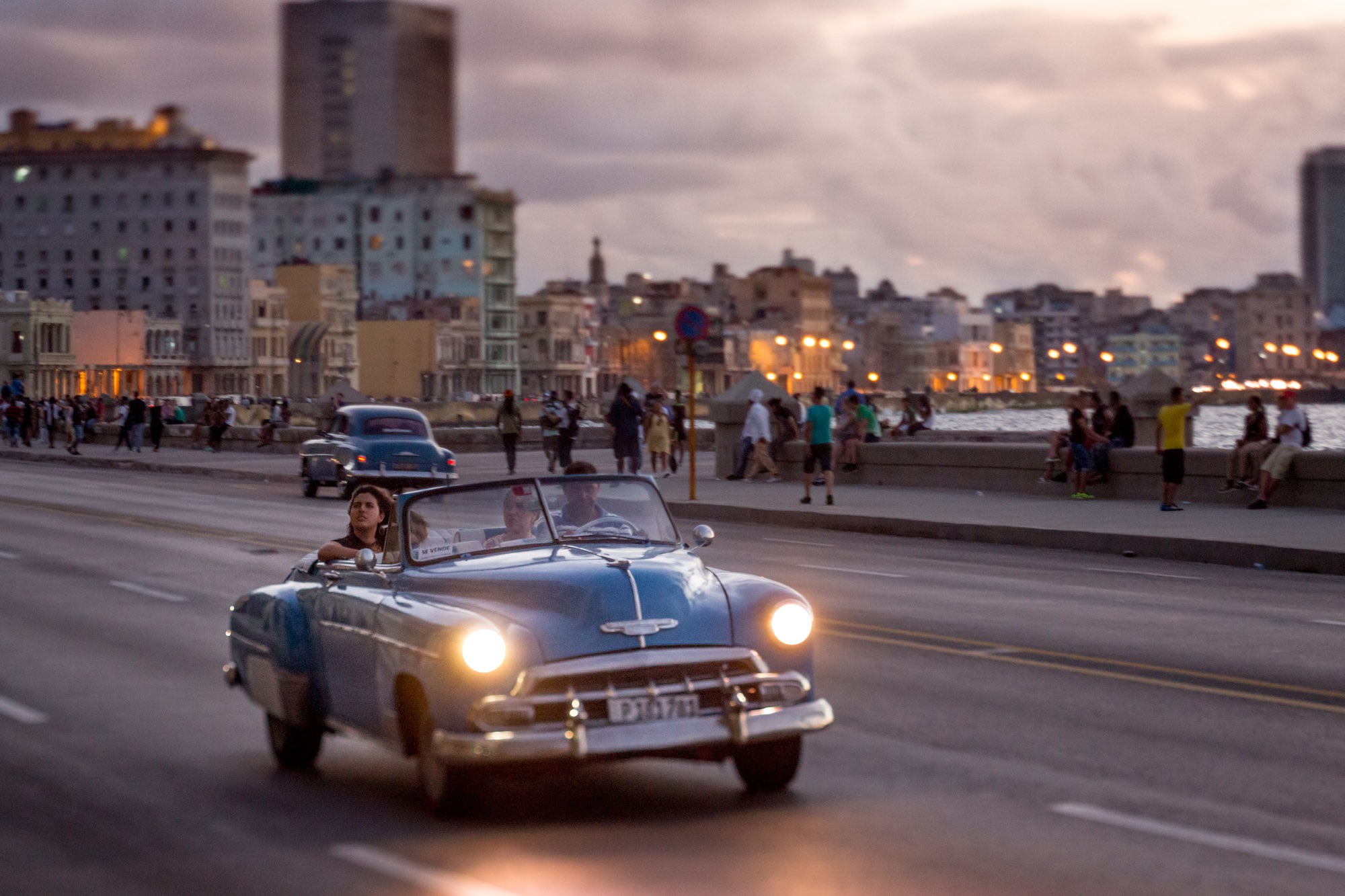 A car driving along the playa in Havana Cuba.