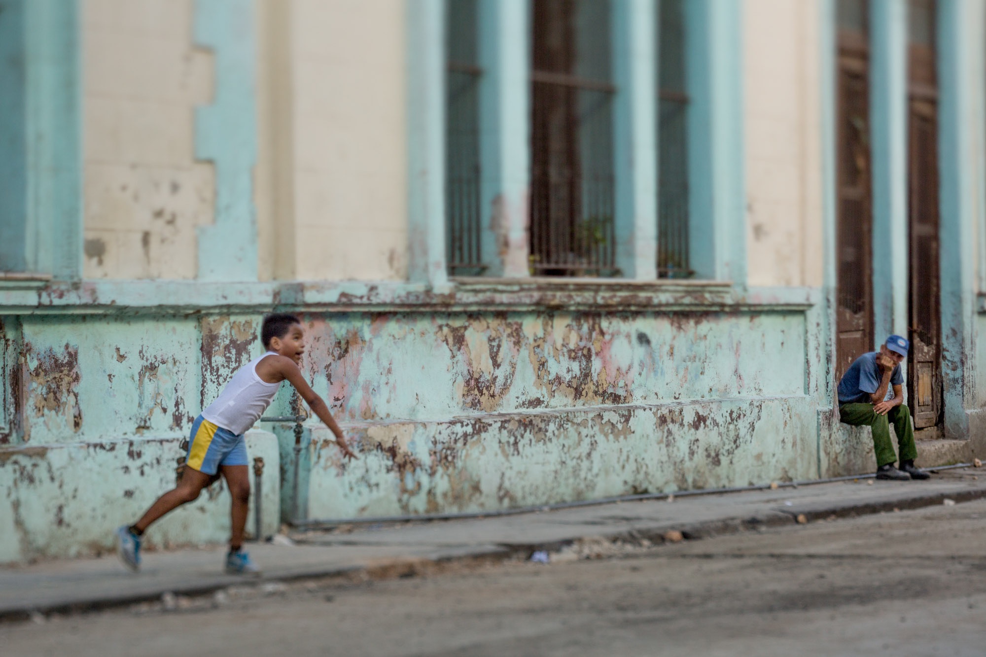 One half of a diptych, Boys playing ball in Cuba.