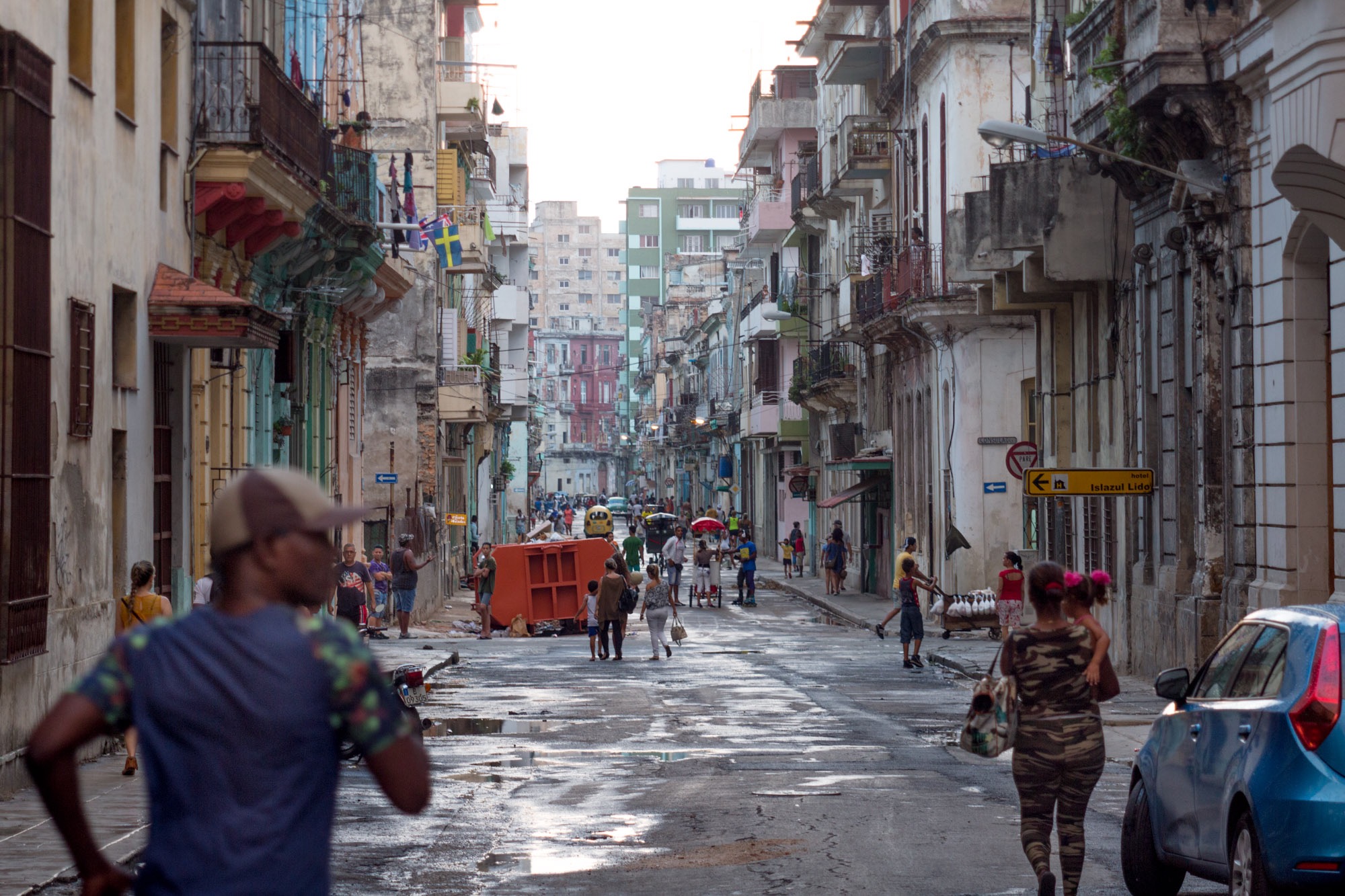 People walking down the street in Havana Cuba.