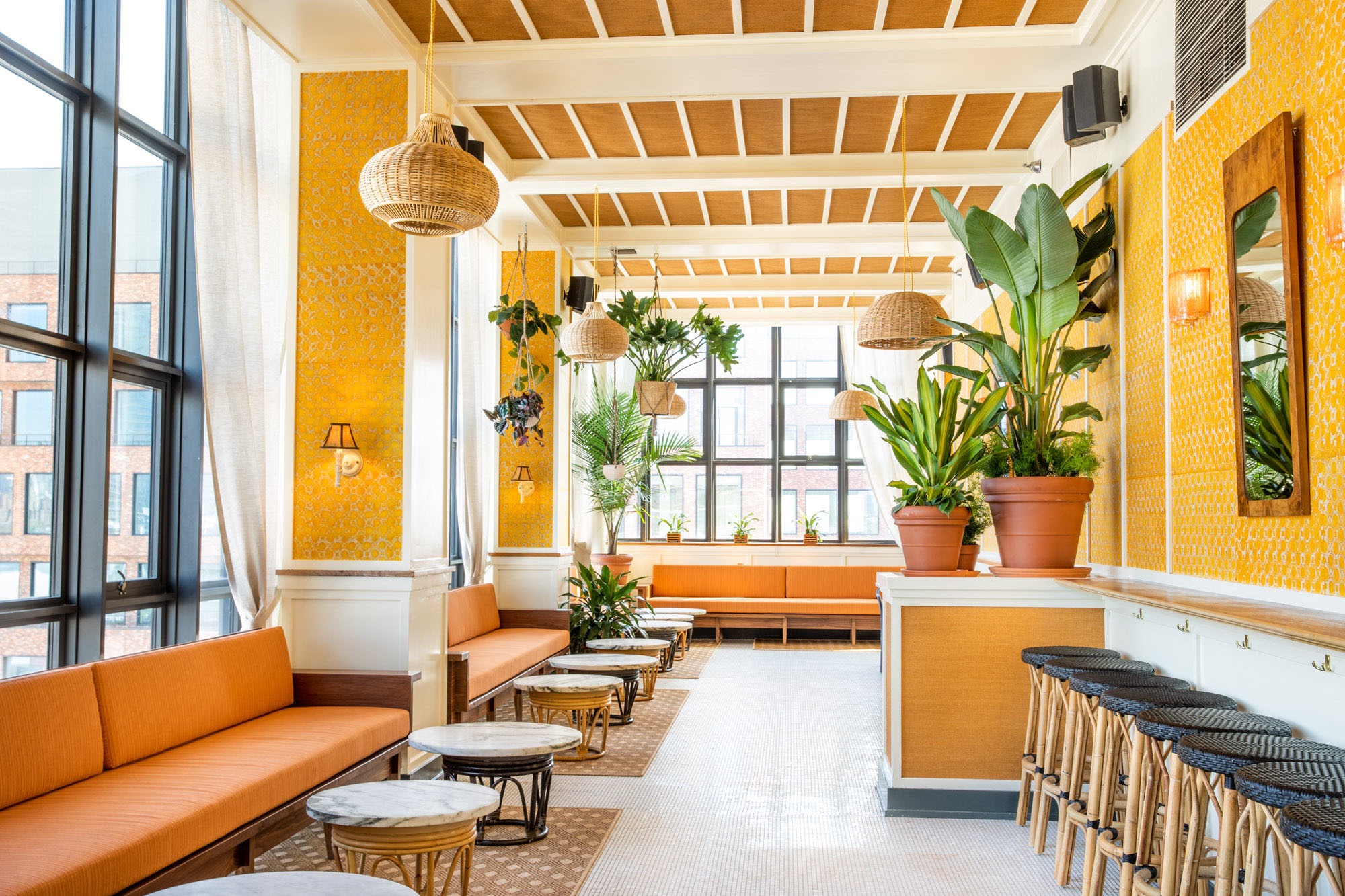 A light airy interior photograph of Lemons, a rooftop bar in the Wythe Hotel.
