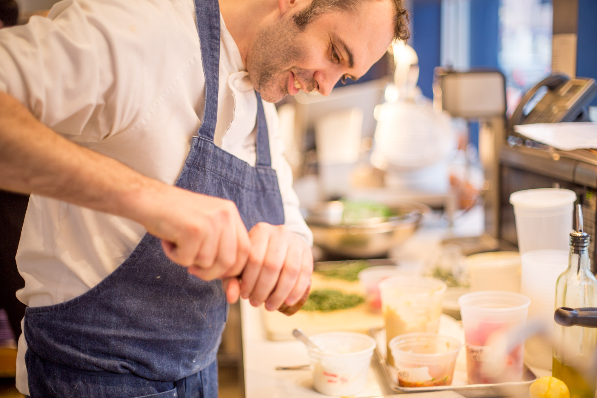 dominique Ansel grinding peper on a dish.