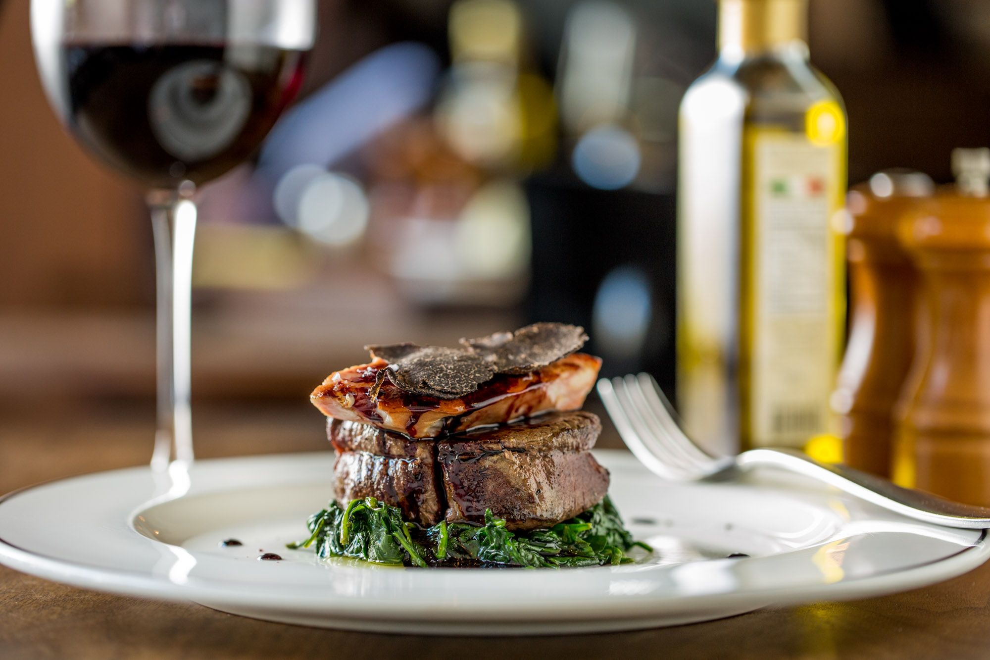 Filet of meat sitting on a table at an Italian restaurant.