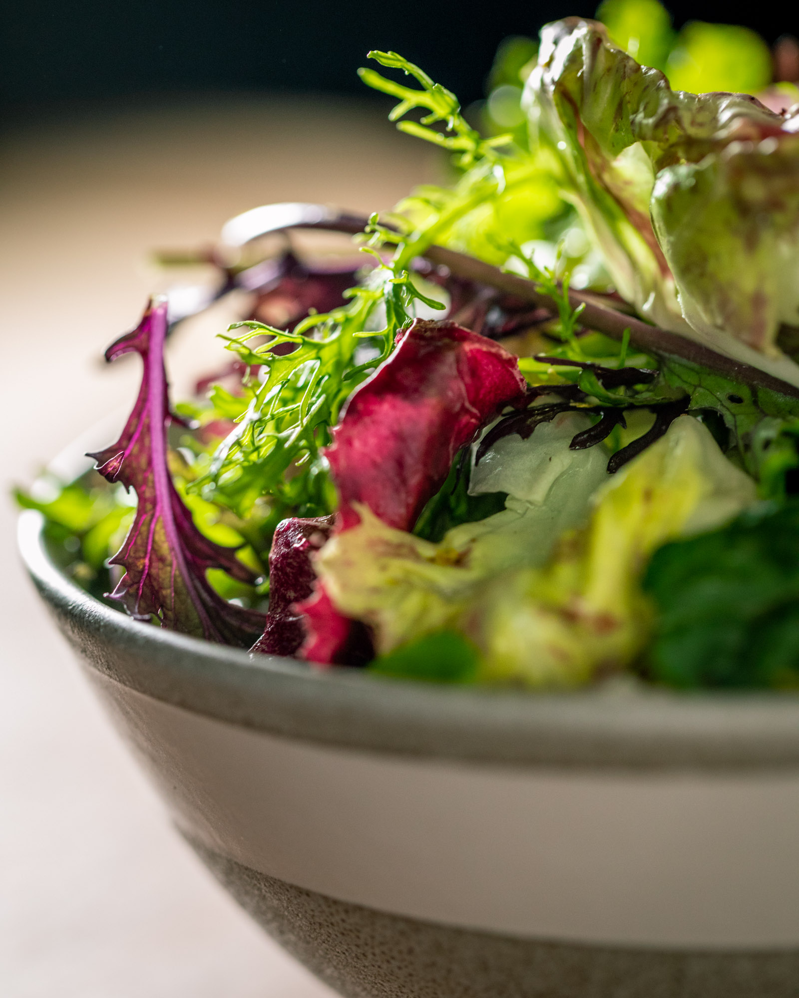 Detail photograph of a salad at Una Pizza Napoletana in NYC