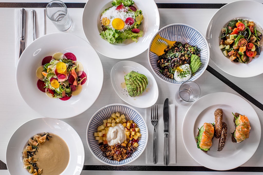 A spread of food on a table of a restaurant