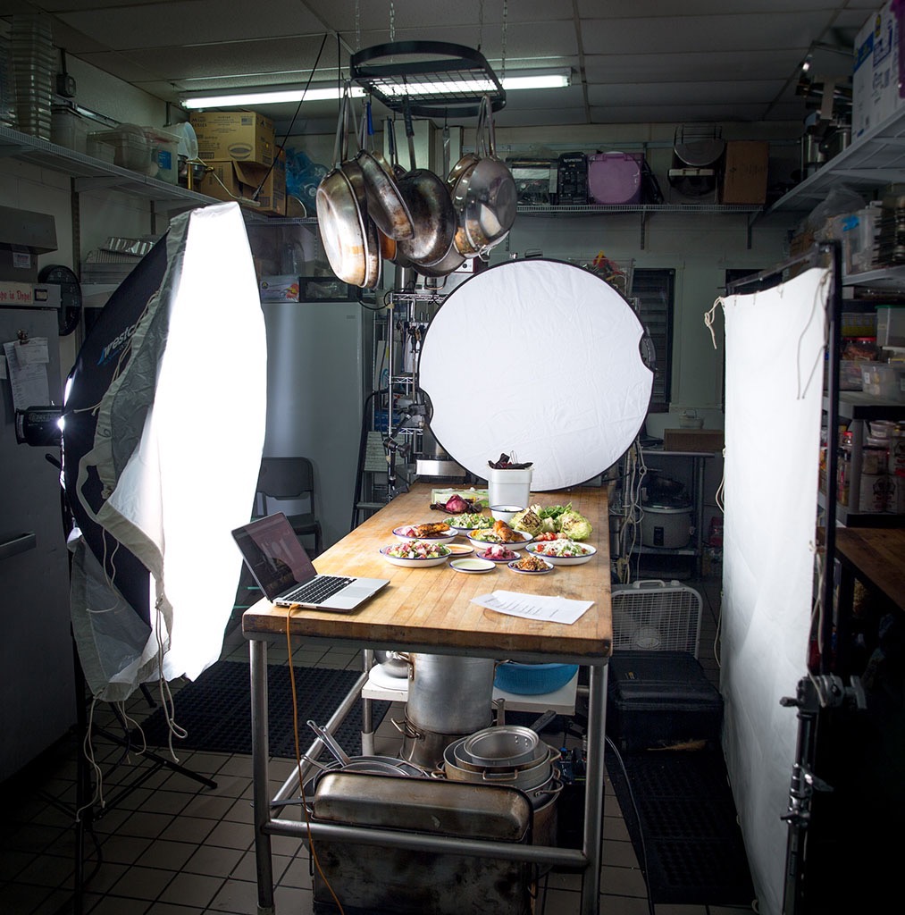 Behind the scenes of food being photographed in a commercial kitchen