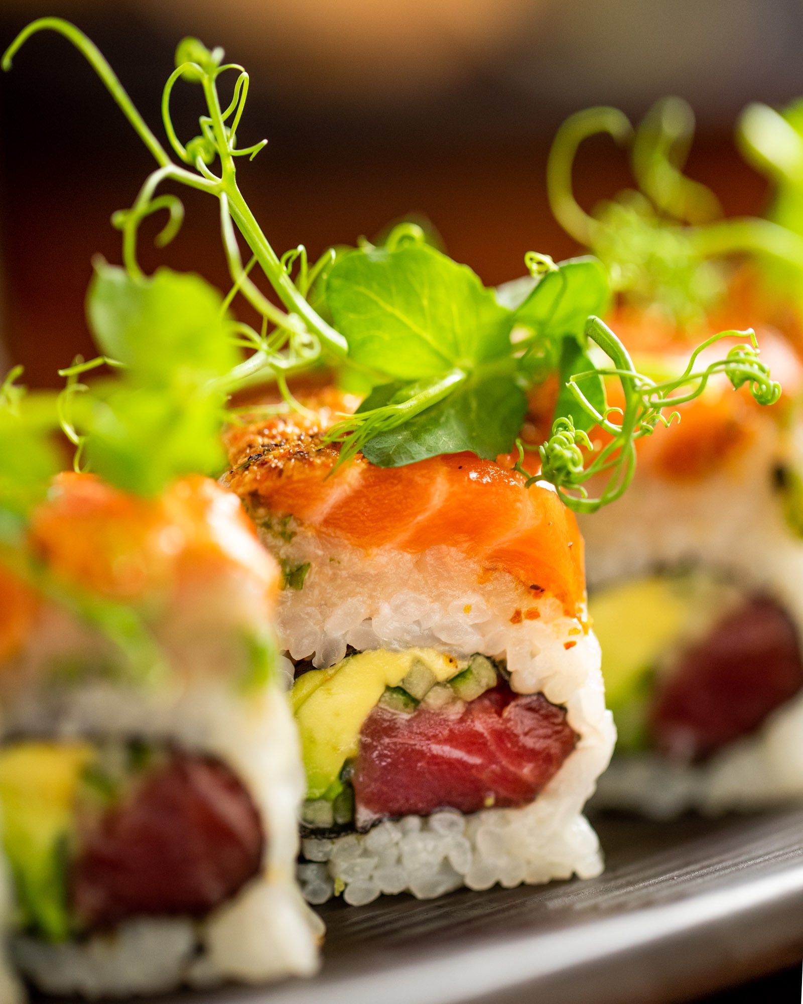 Closeup photograph of a roll of sushi at a japanese restaurant in brooklyn