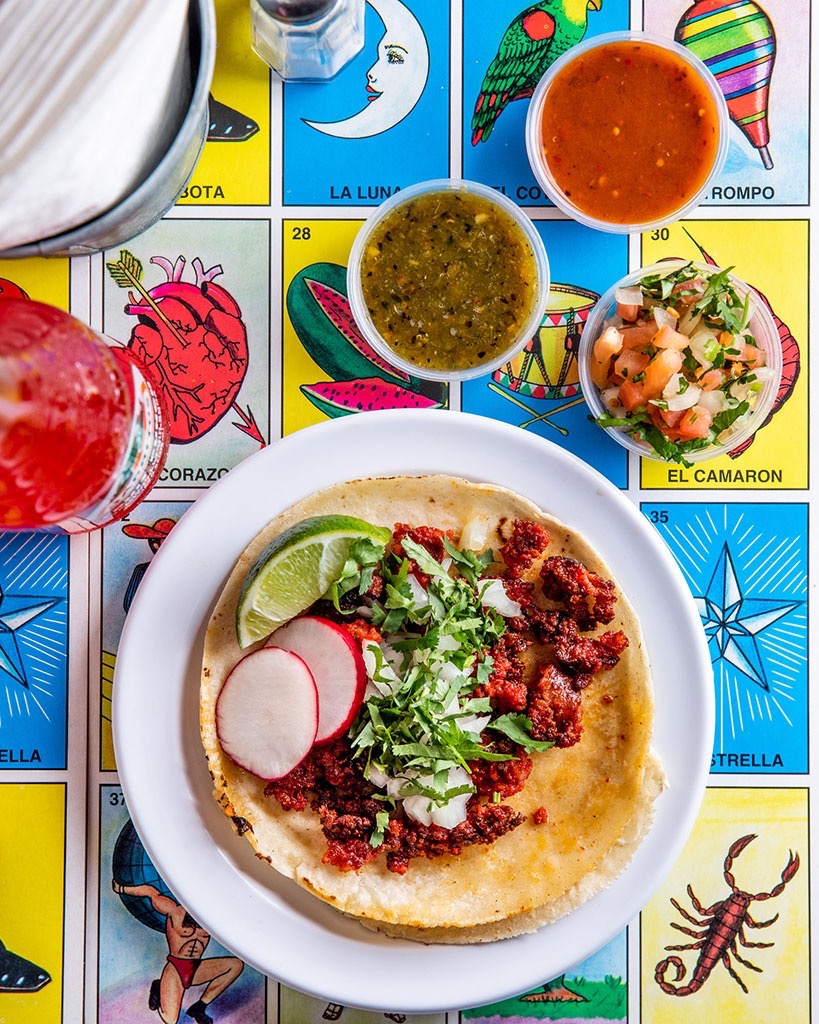 Tacos photographed against a colorful background