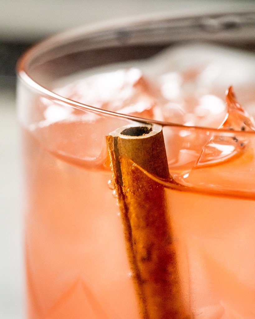 Creative Food Photography of a cinnamon stick in a cocktail