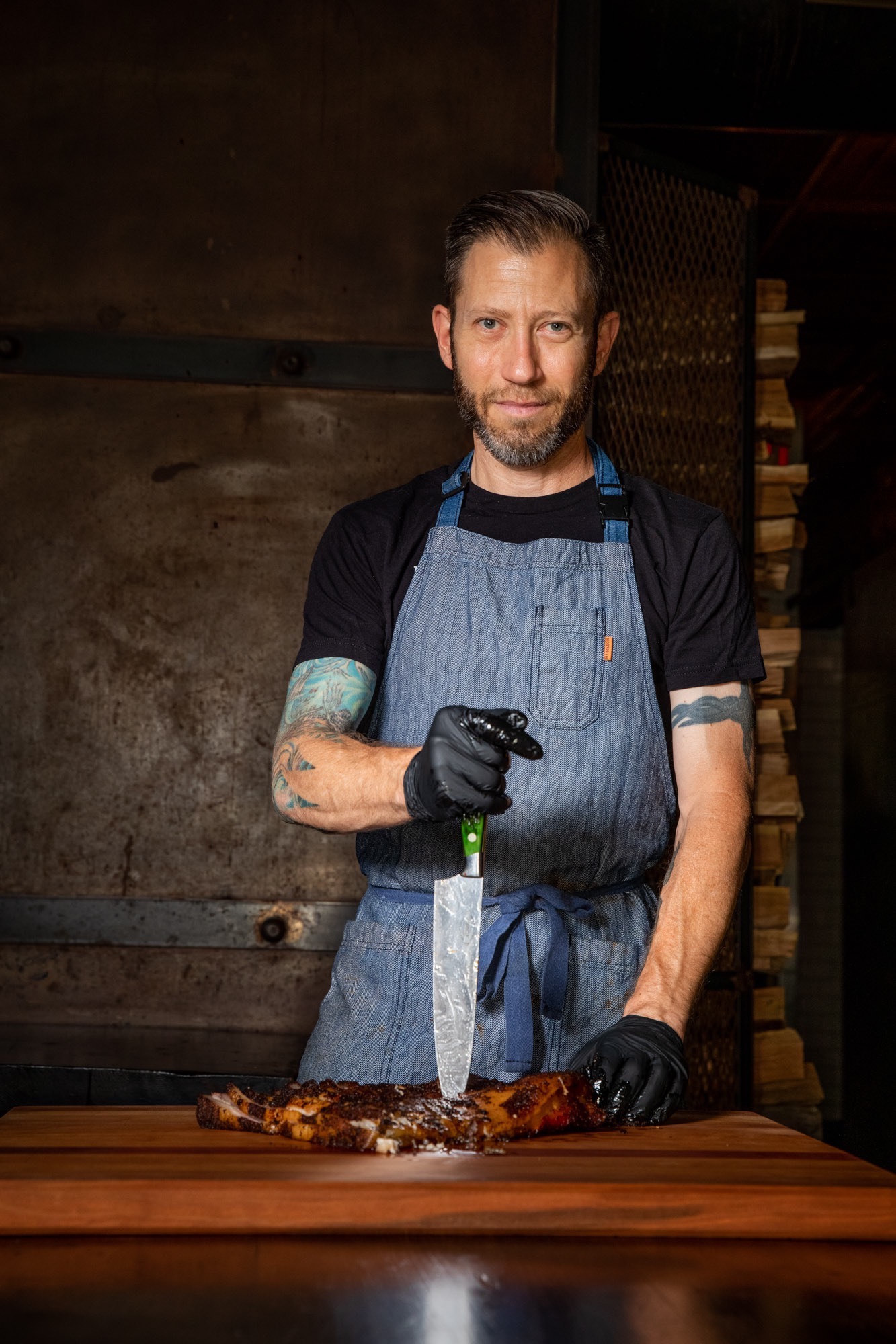 A pitmaster posing for a portrait
