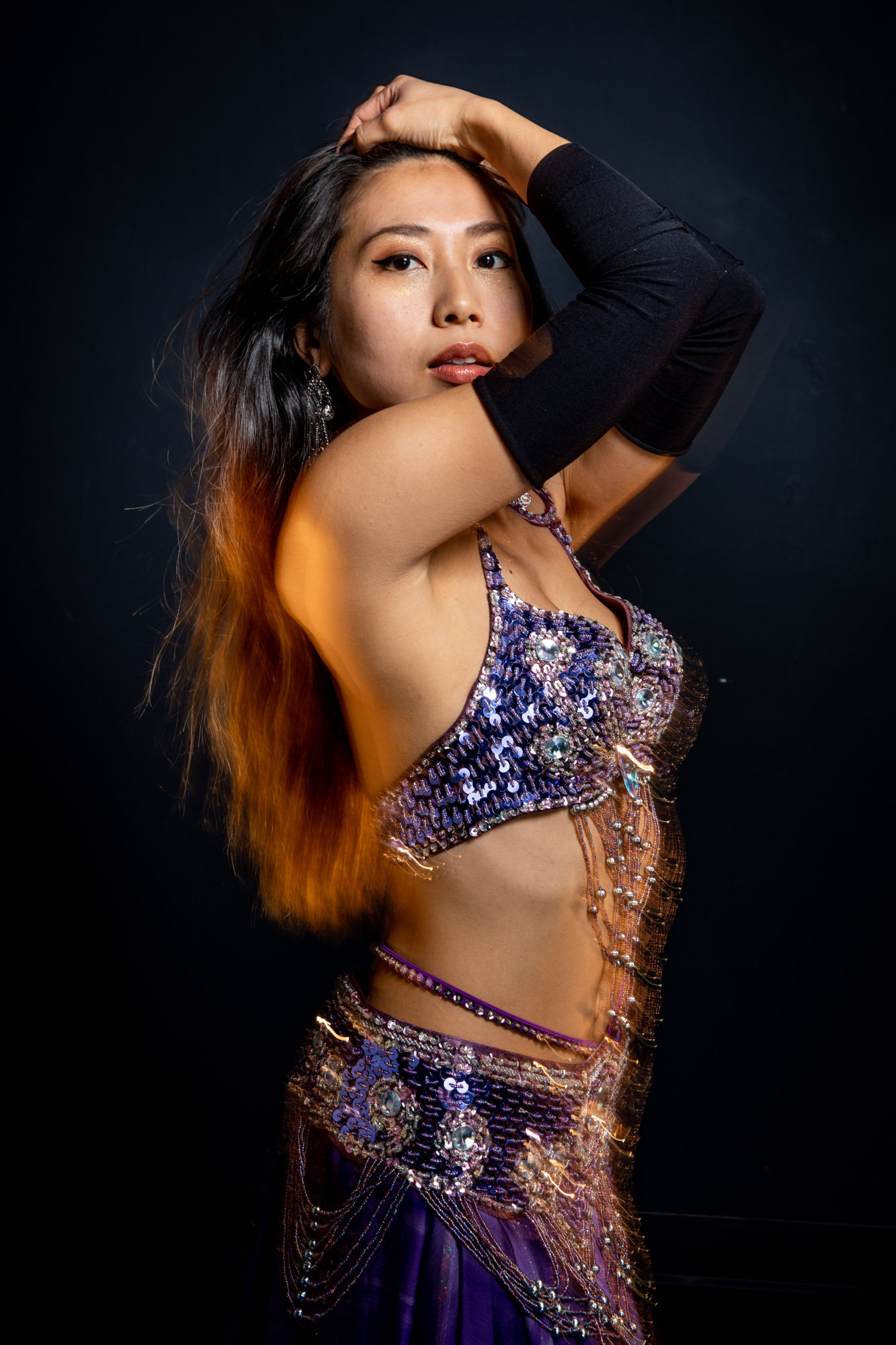 a belly dancer posing with her sword