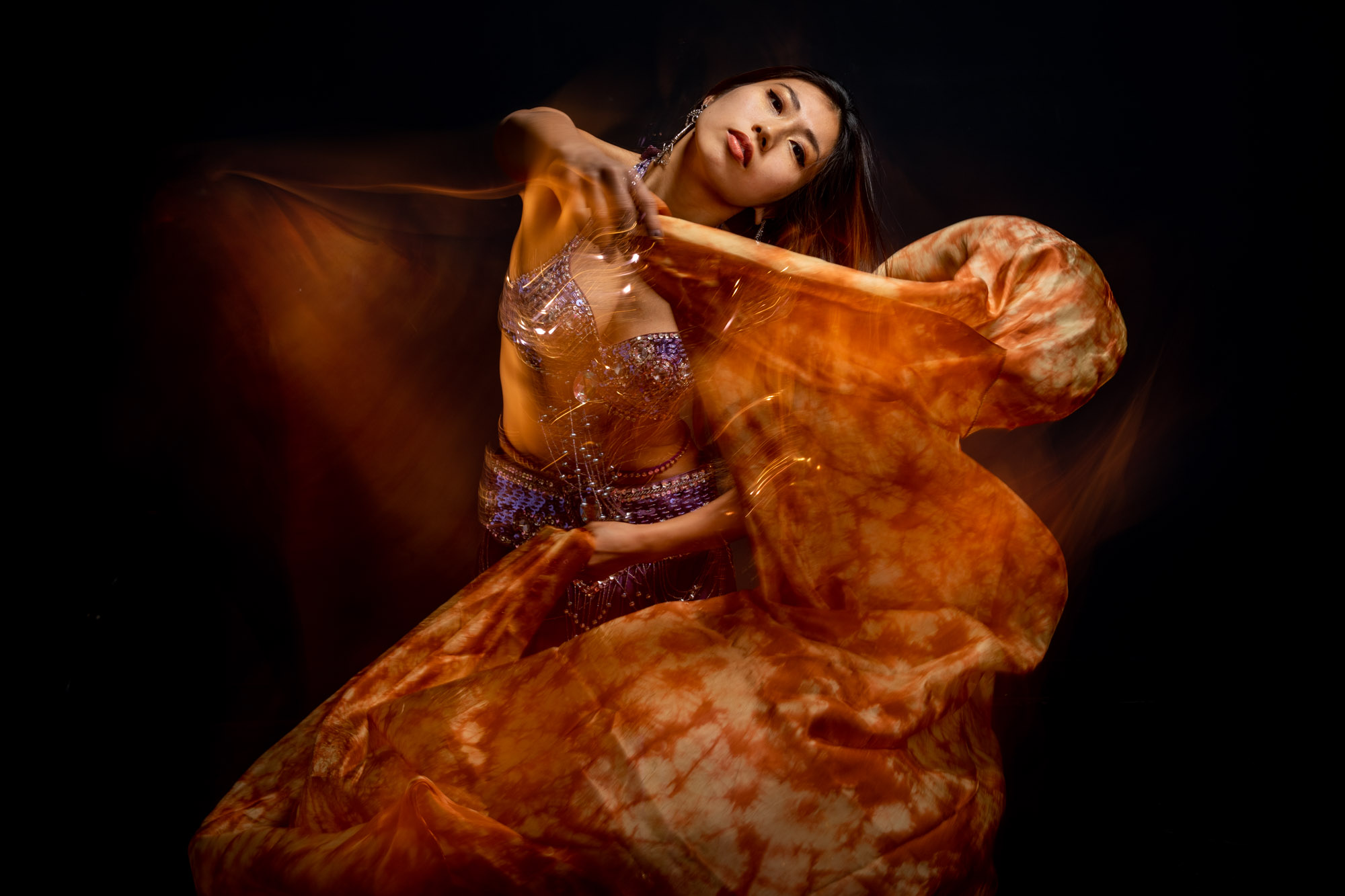 a belly dancer posing with her sword