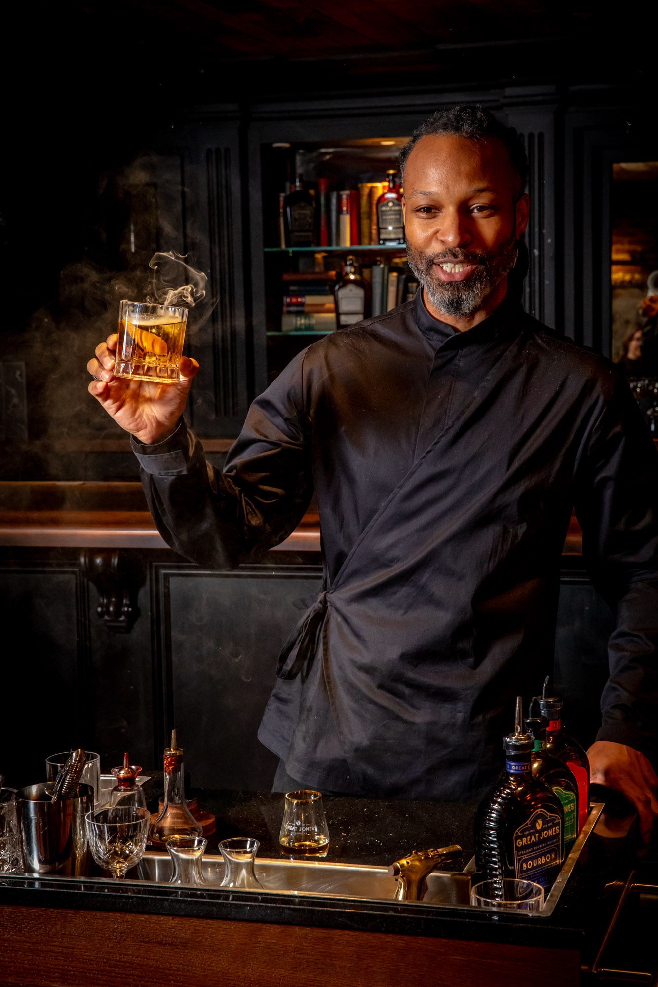 Bartender raising a glass