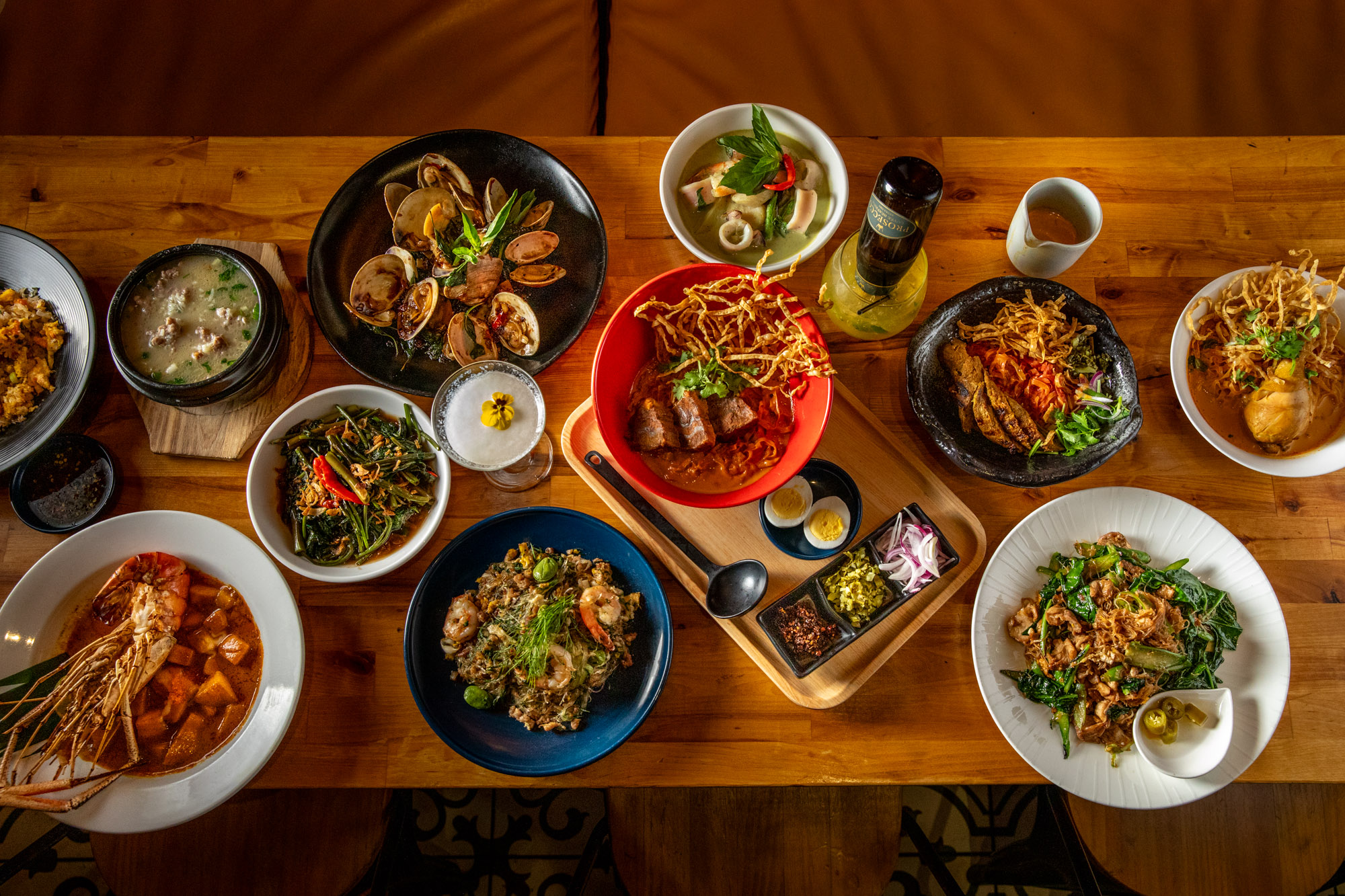 A spread of Thai food photographed at Zaab Zaab in Elmhurst Queens