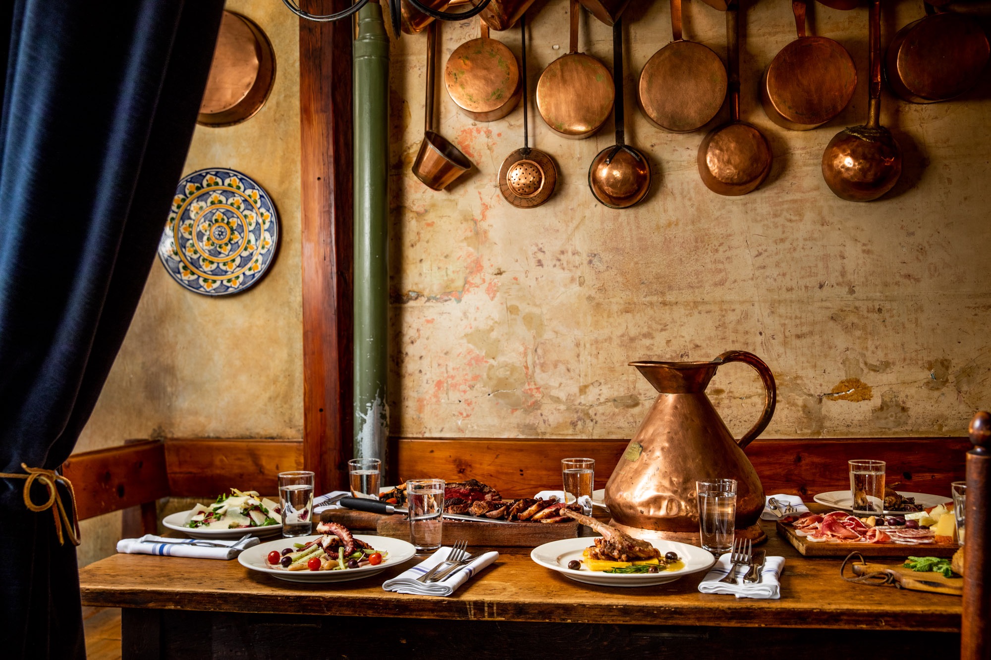 A table full of food waiting for people to sit down to eat.